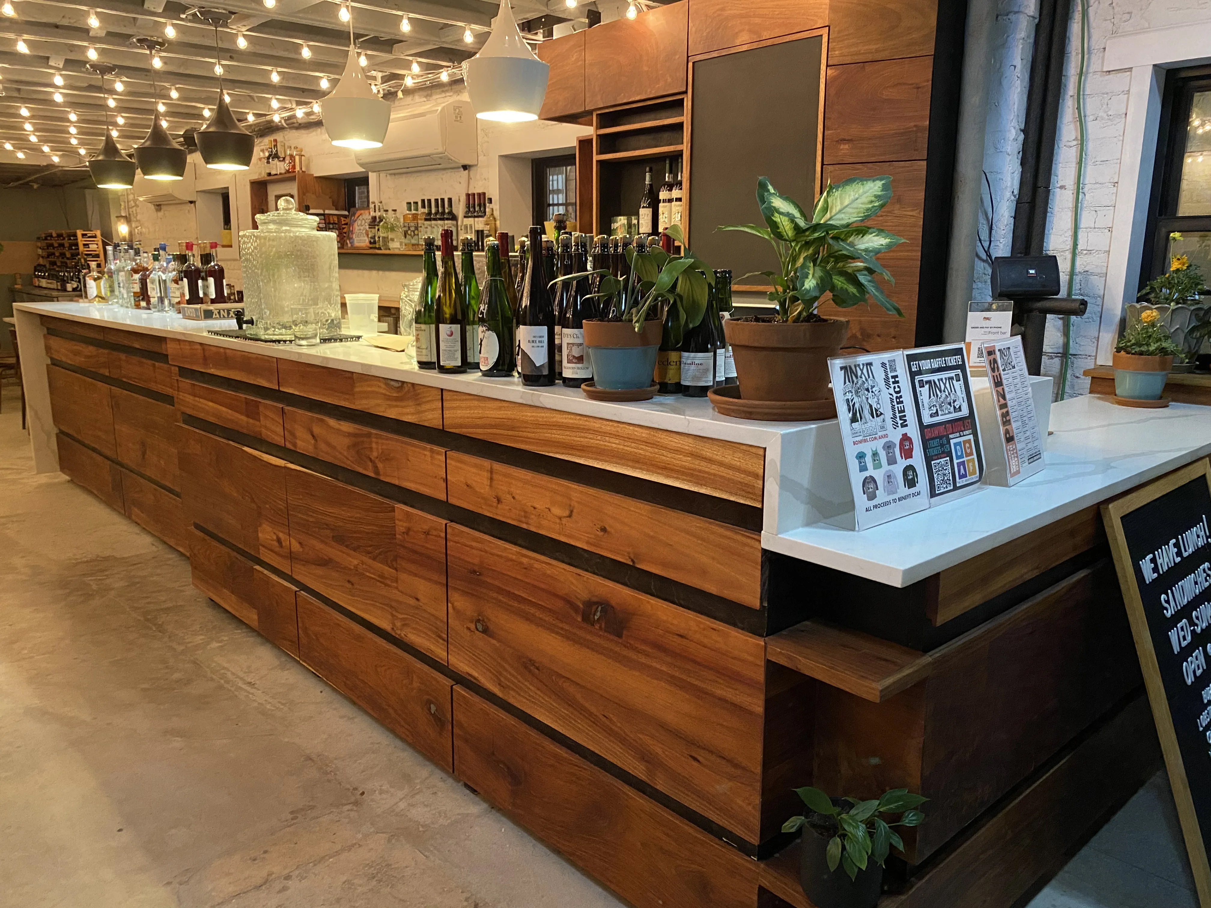 Restaurant bar, acacia and walnut fronts, waterfall quartz